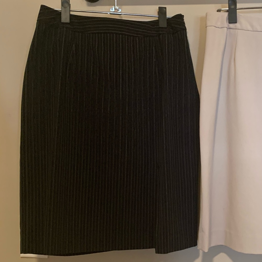 Pinstripe black pencil skirt w over the knee slit.
